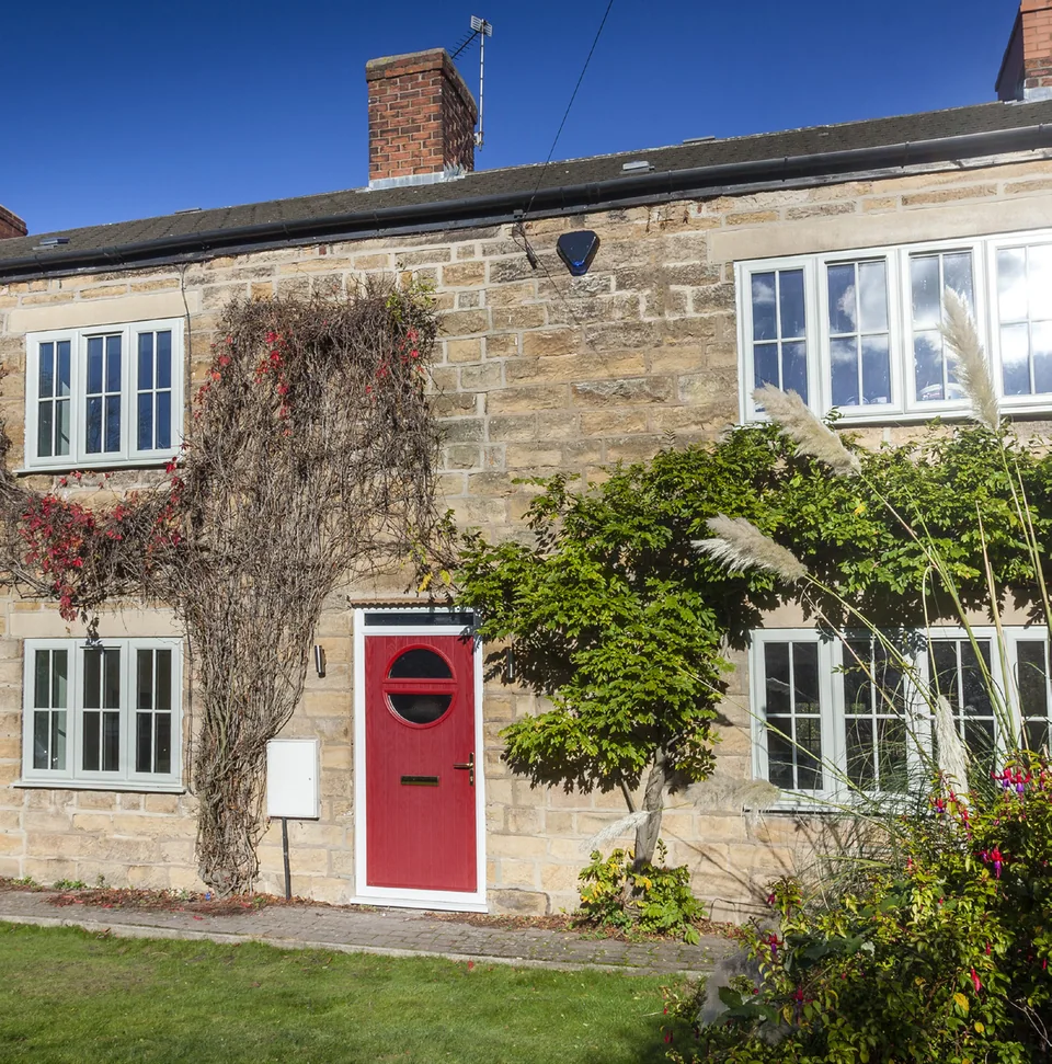 Stone cottage with a red composite door – Roundhay Windows And Doors
